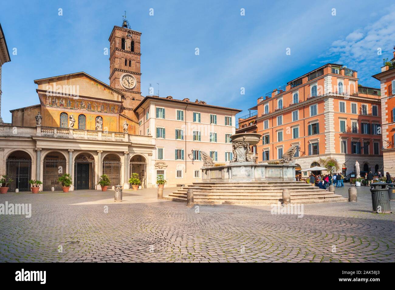 Fountain and Church of Santa Maria in Piazza di Santa Maria, Trastevere, Rome, Italy Stock Photo