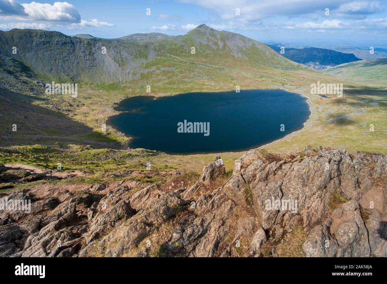 Red Tarn below Catstye Cam viewed from Striding Edge on Helvellyn in the English Lake District Stock Photo