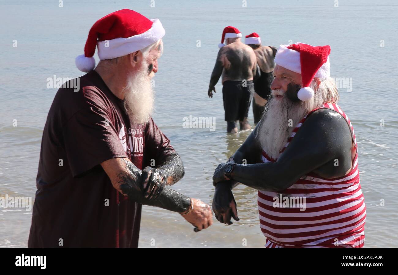 Dead Sea. 7th Jan, 2020. People dressed up as Santa Claus stand in the Dead Sea, Jan. 7, 2020. As part of a 4-day tour, 50 Santa Clauses and Miss Santas visited the Dead Sea on Tuesday. Credit: Muammar Awad/Xinhua/Alamy Live News Stock Photo
