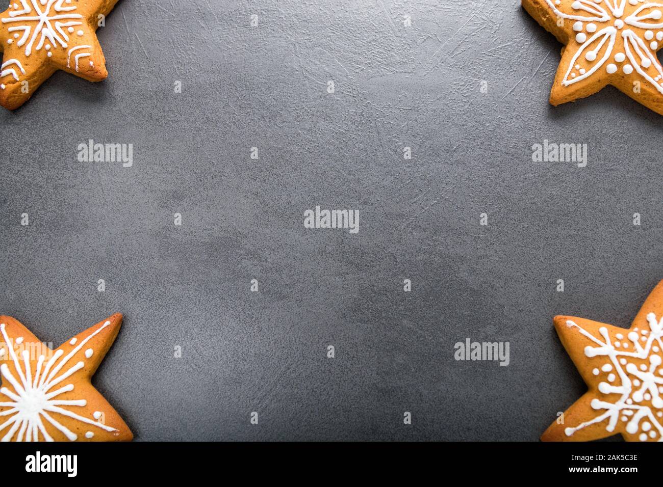 Christmas homemade gingerbread cookies on dark background. Stock Photo