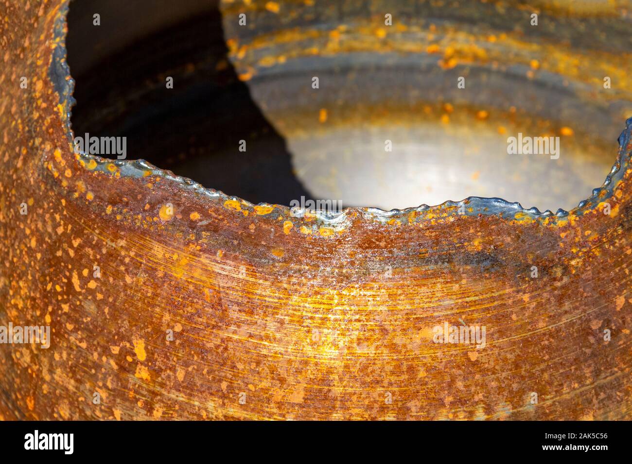 full frame abstract sunny illuminated rusty metalllic background Stock Photo