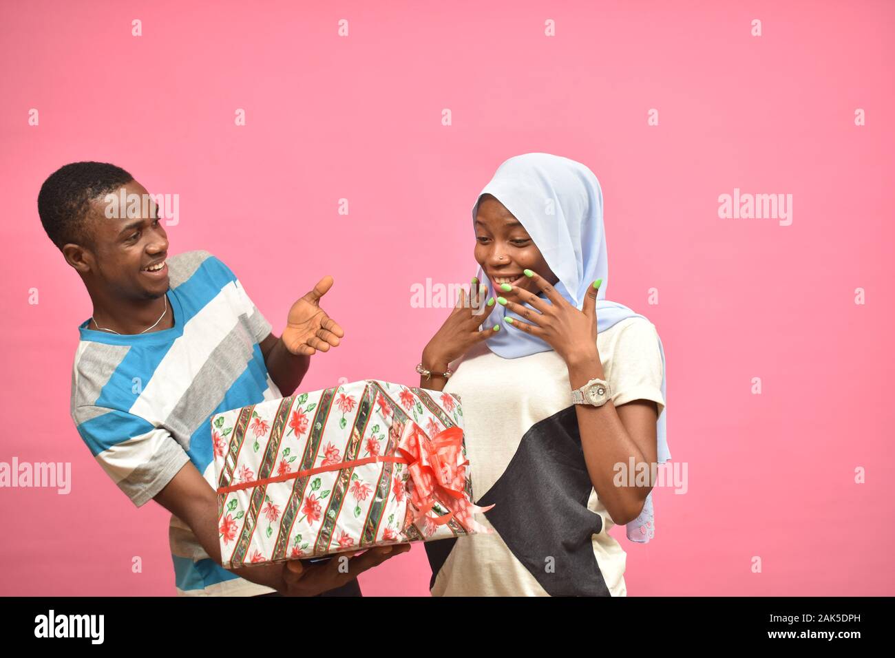 a man giving woman gift