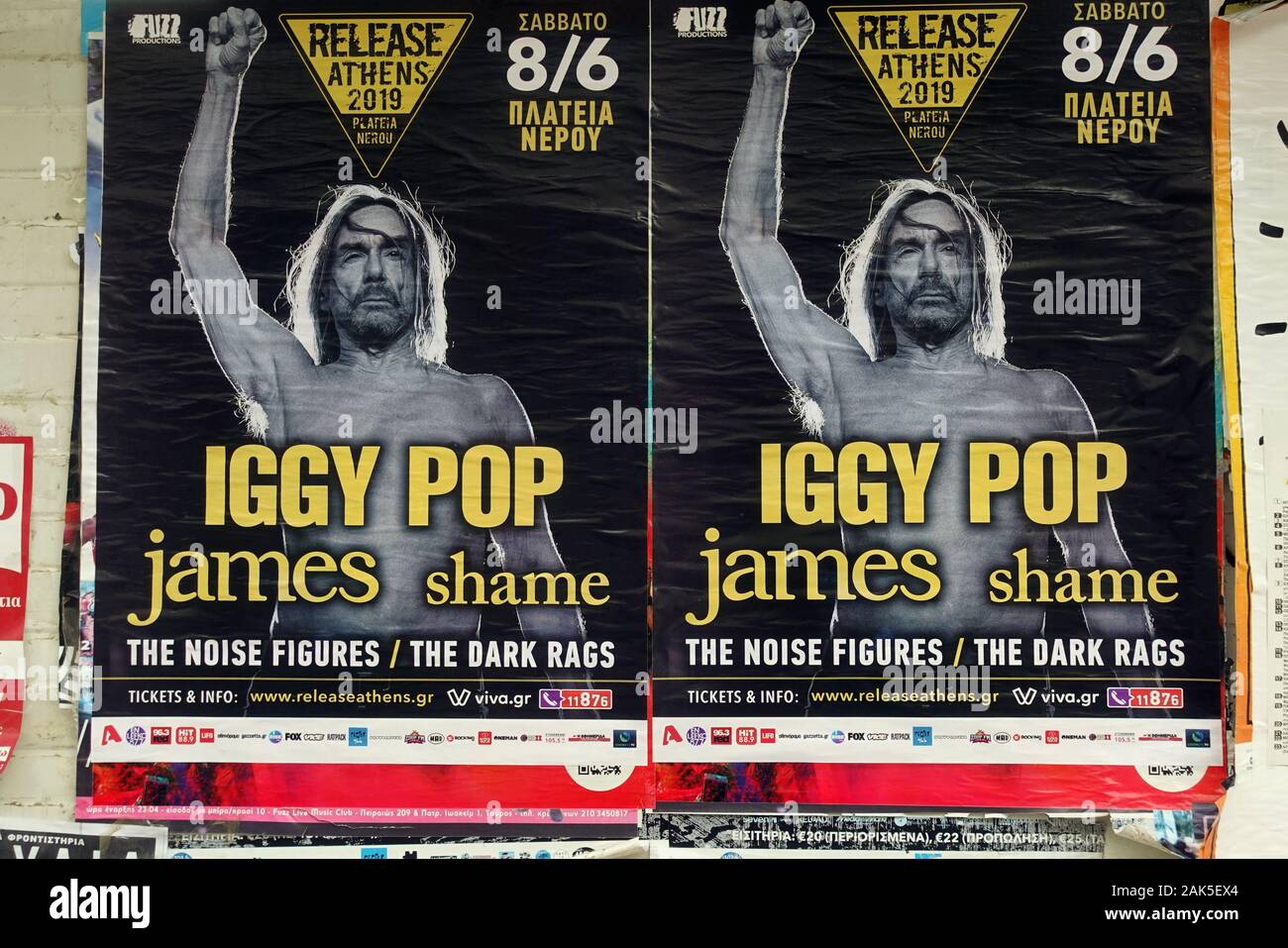 ATHENS, GREECE - MAY 20, 2019: Iggy Pop rock music live concert posters on dirty wall. Stock Photo