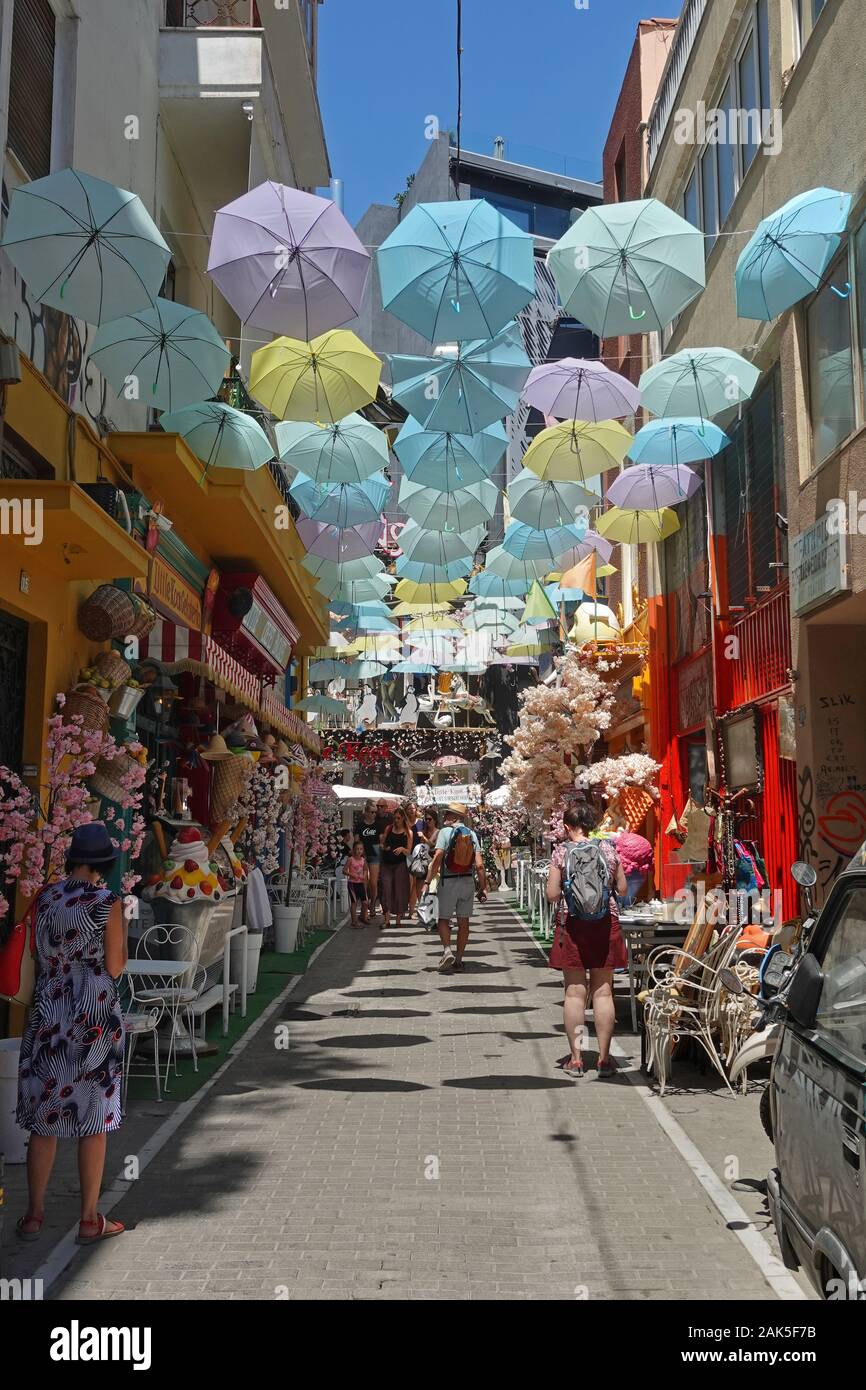 Athens, Greece - August 7, 2019: Pedestrian walkway in downtown Athens with people walking under canopy of colorful umbrellas. Stock Photo