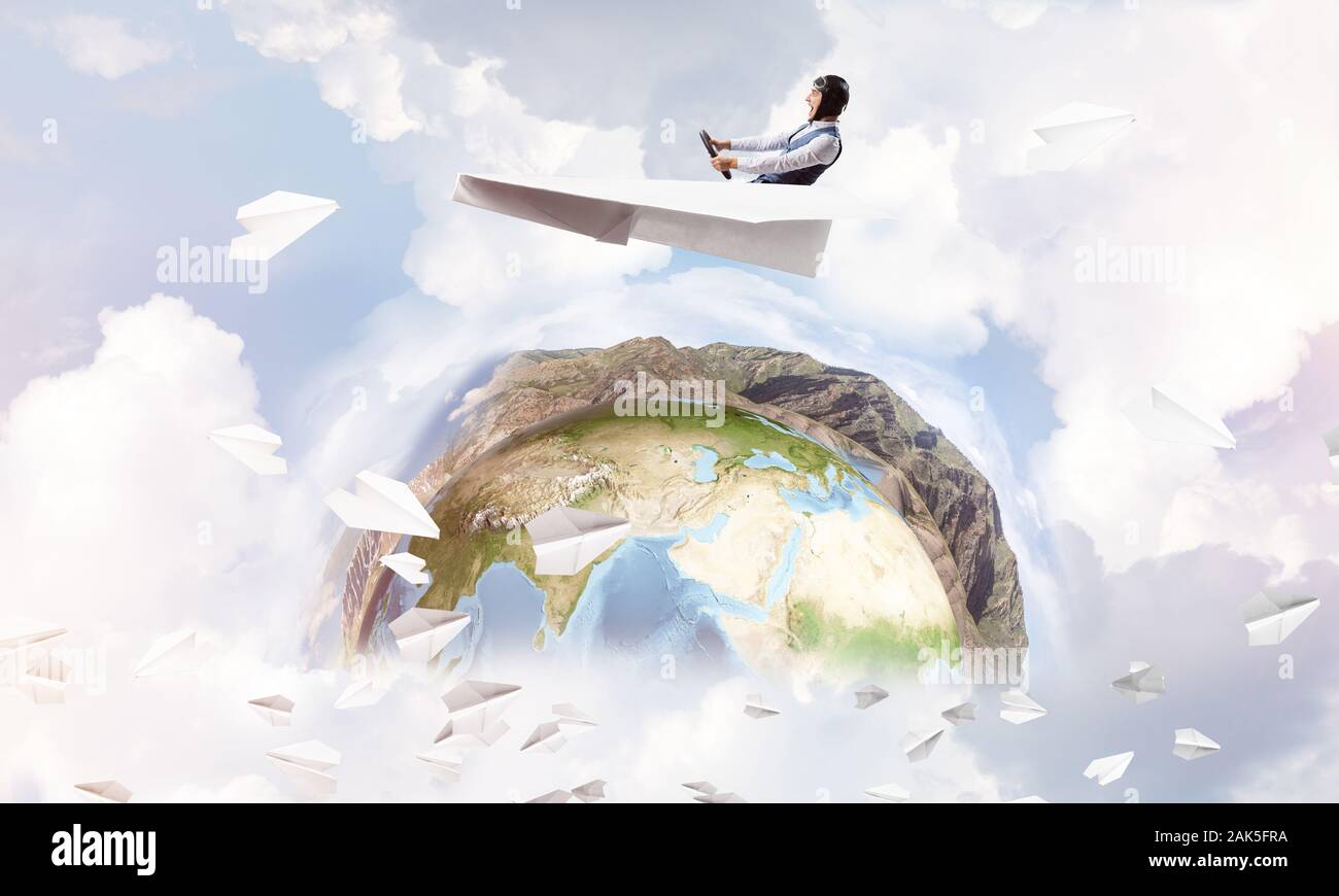 Pilot in leather helmet driving paper plane Stock Photo - Alamy