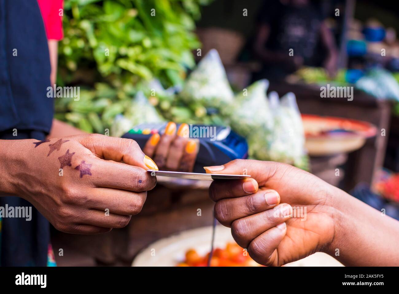 Close Up Of An African Woman Selling In A Local African Market