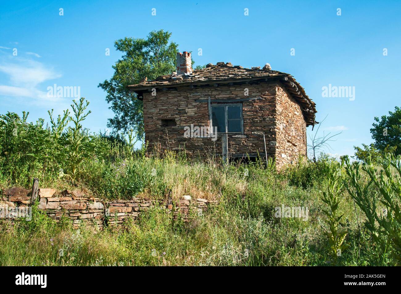Old rural country stone house facade in sunny summer day Stock Photo ...