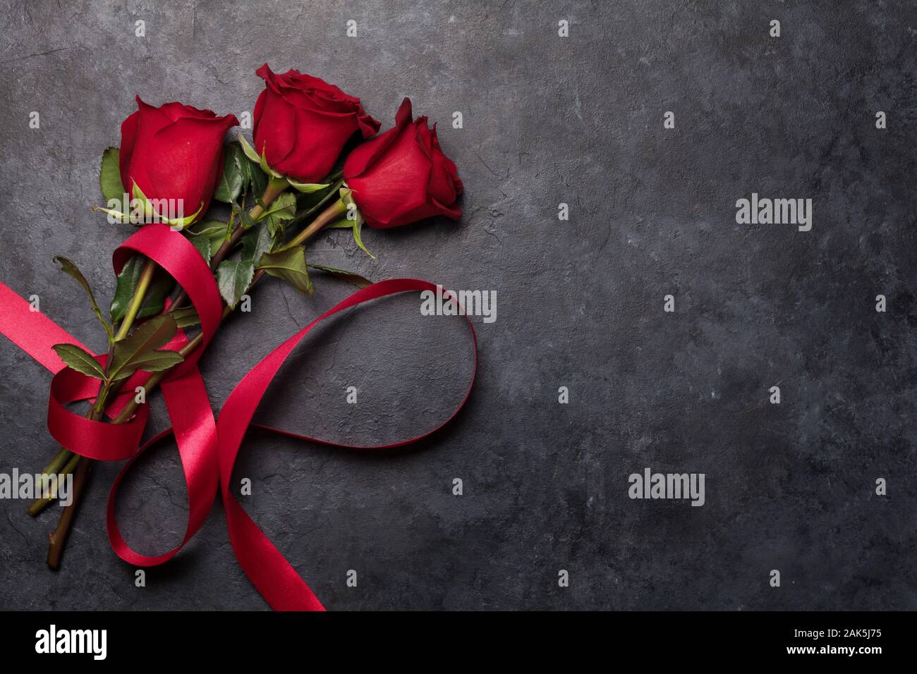 Valentines day greeting card with rose flower bouquet and red ribbon ...
