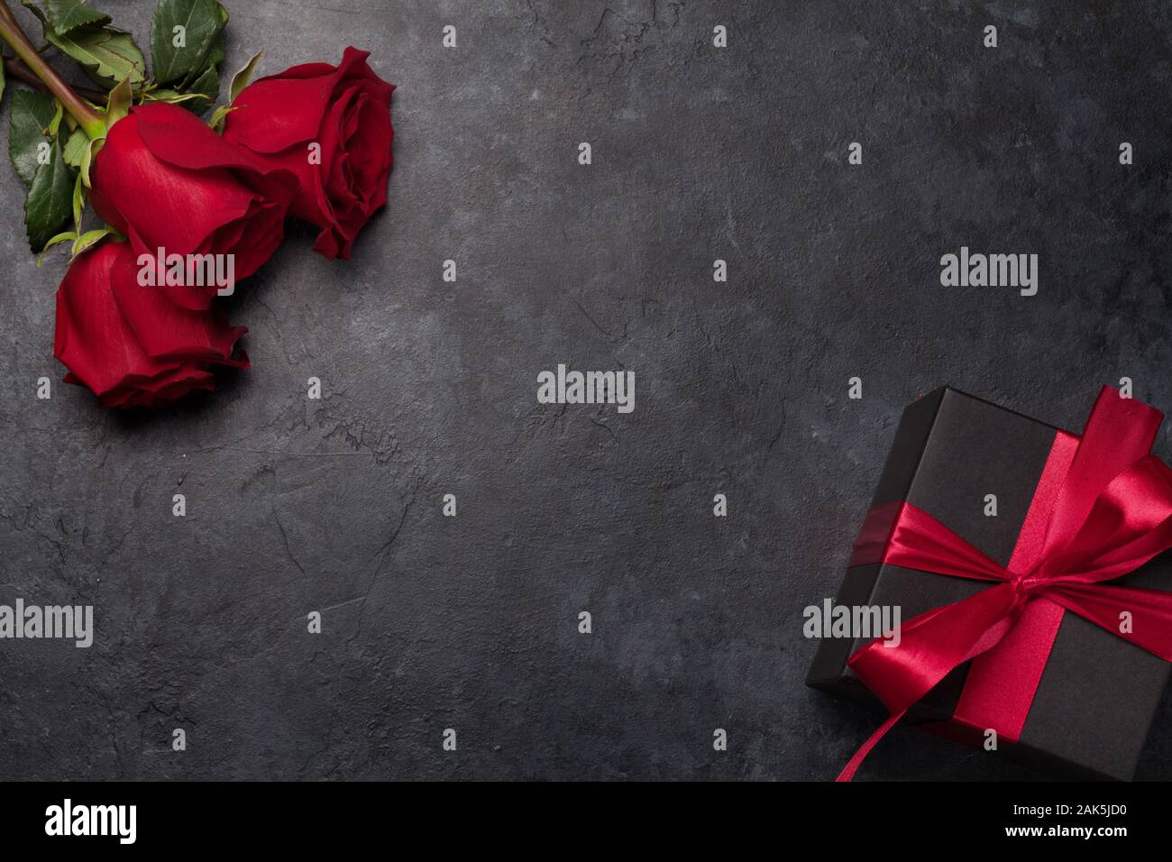 Valentines day greeting card with rose flower bouquet and gift box over ...