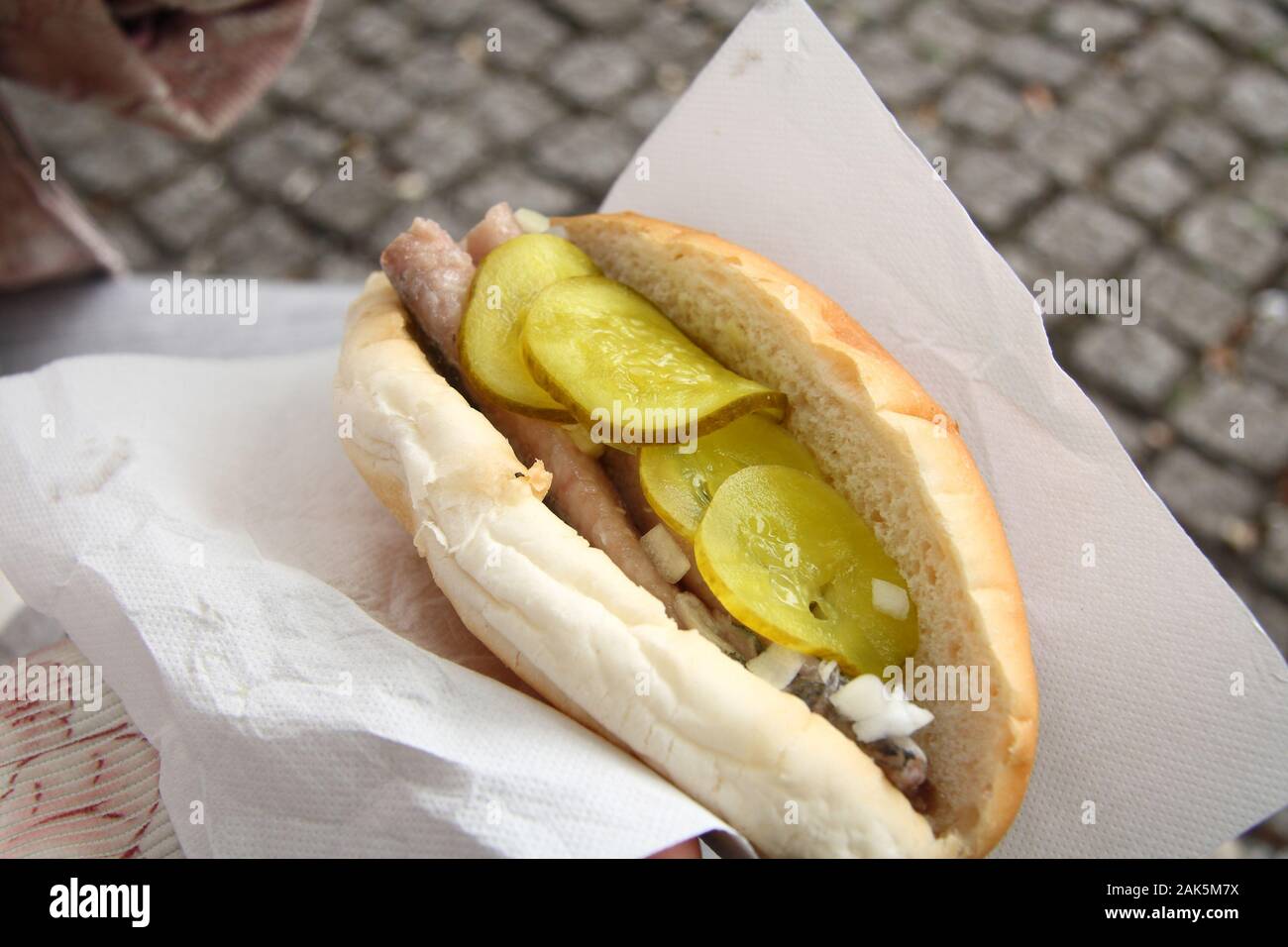 Traditional Dutch sandwich with marinated herring and bittersweet