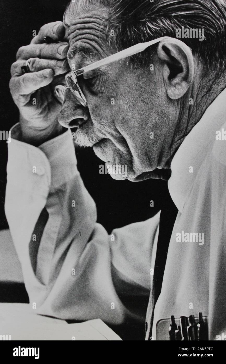 Fine 1970s black and white vintage photography of an older man furrowing his brow and reading something Stock Photo