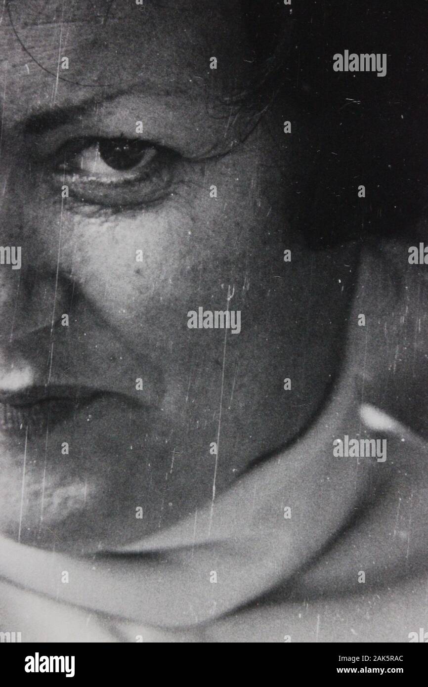 Fine 1970s black and white vintage photography of a woman intently ...