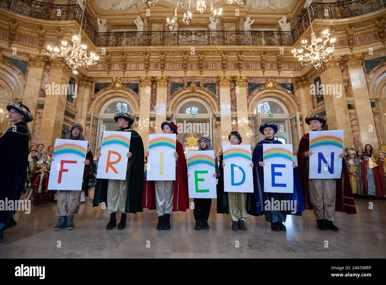 Stuttgart, Germany. 07th Jan, 2020. Carol singers hold in their hands
