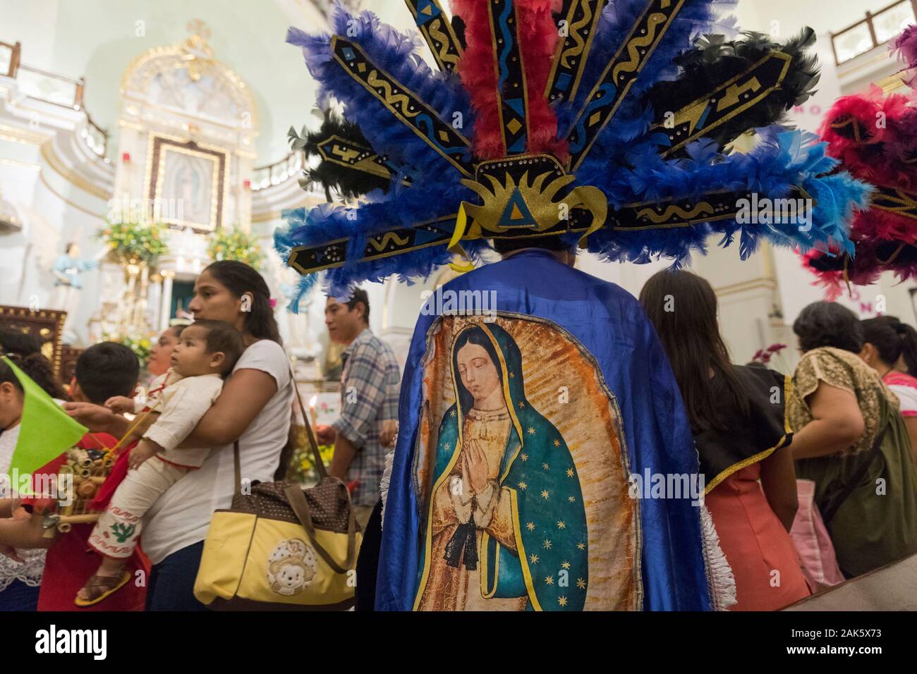 Festival of Our Lady of Guadalupe, indigenous participant in colourful attire Stock Photo