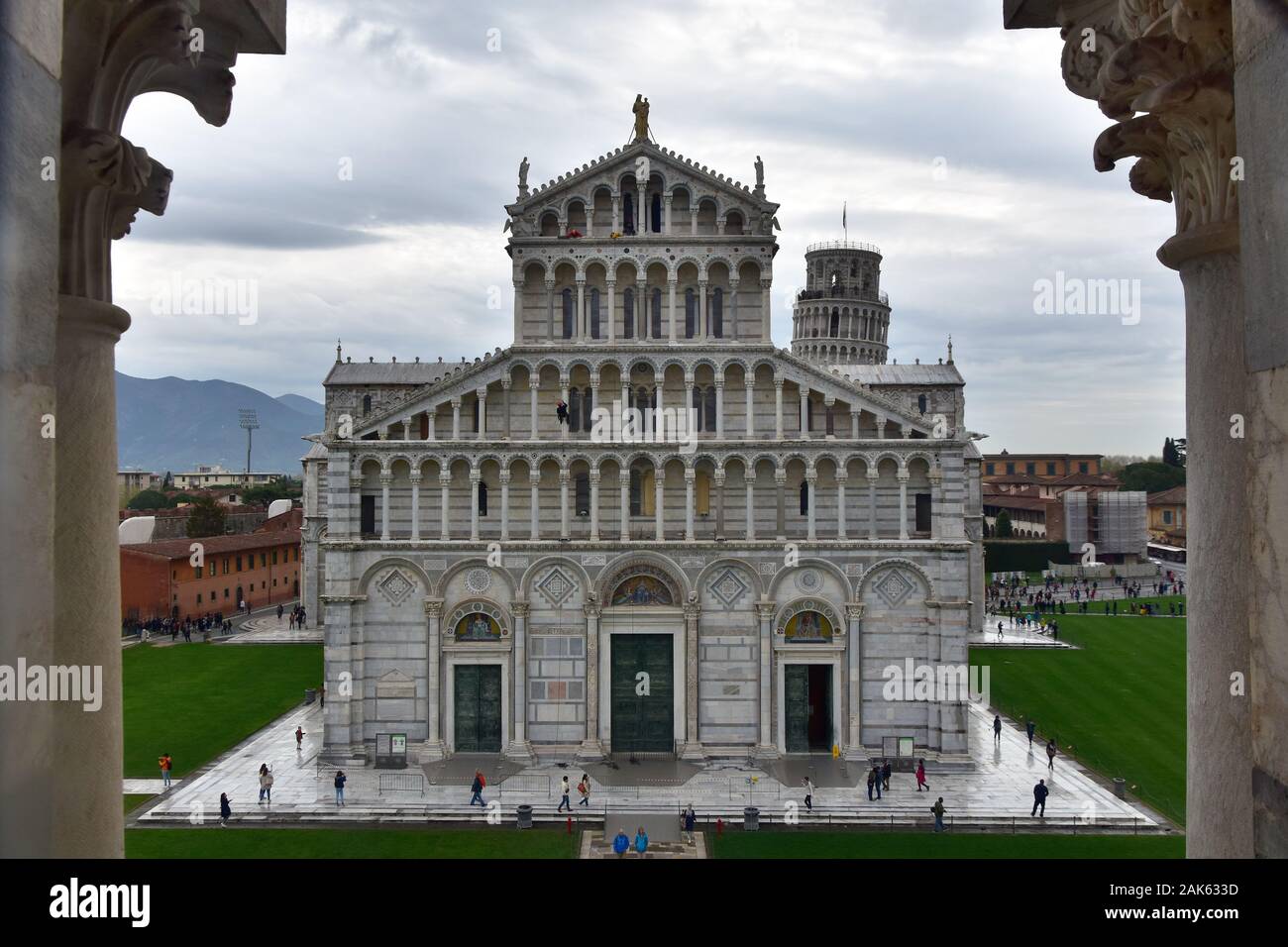 Rainy day in Pisa, Italy. View from Baptistery to the Square of Miracles, Santa Maria Assunta Cathedral - Il Duomo and the Leaning tower Stock Photo