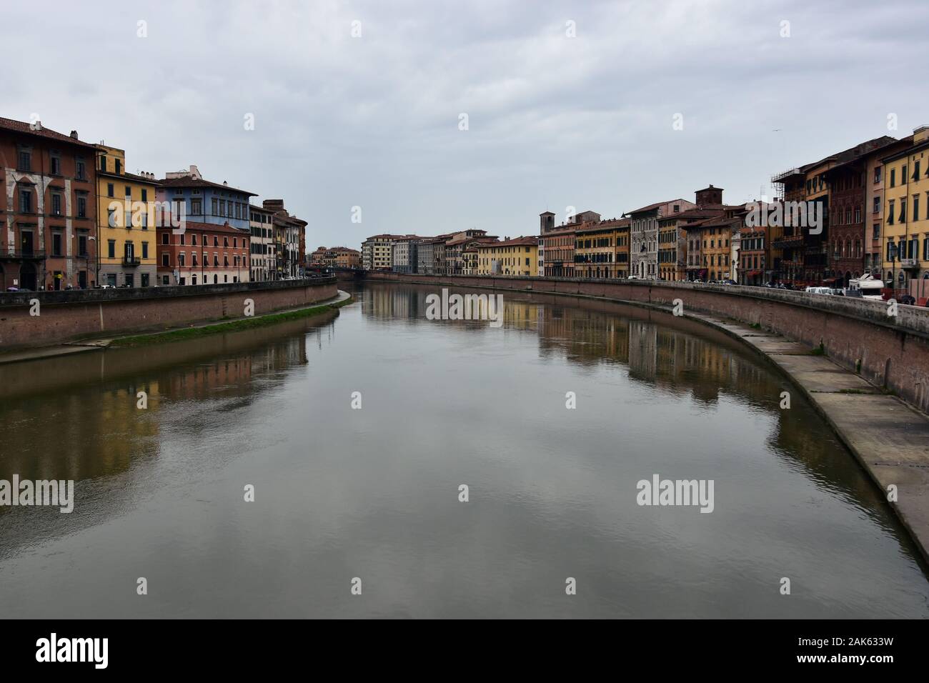Dark cloudy spring day by Arno River, Pisa, Italy Stock Photo