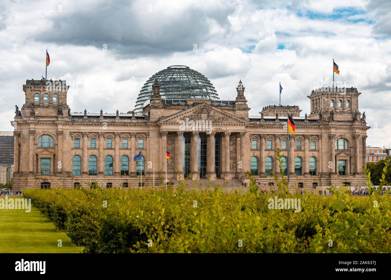 German flag flying next to the Reichstag or German parliament building, Regierungsviertel or government quarter, Berlin, Germany, Europe Stock Photo