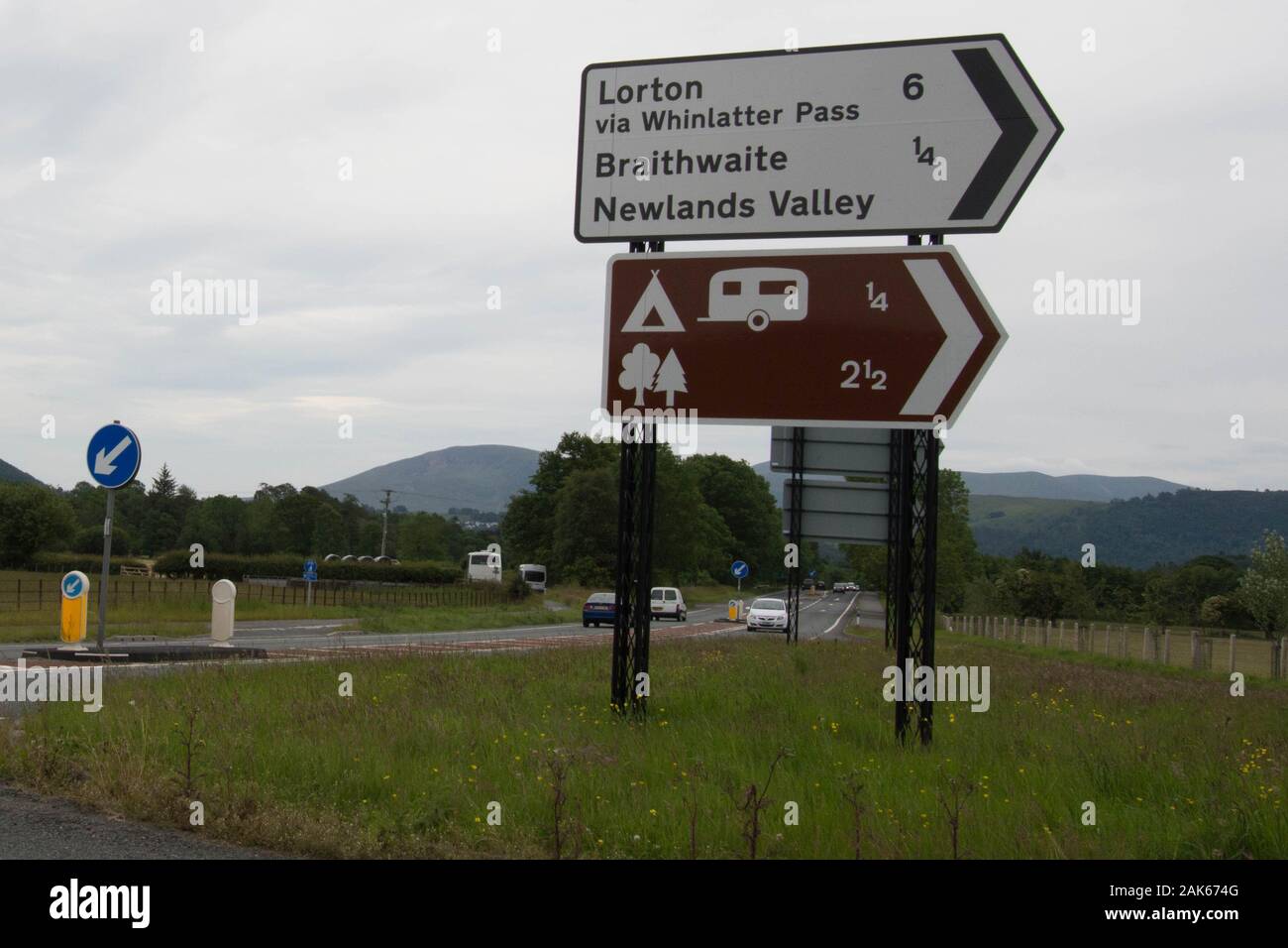 Sign posts Lorton Whinlatter pass Braithwaite Newland Valley Lake District Cumbria UK Whinlatter pass Via camping caravans caravan camp arrow sign Stock Photo