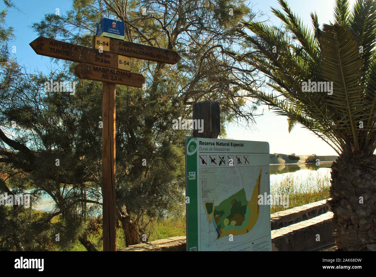 A signpost and information sign overlooking the nature reserve in Maspalomas, Gran Canaria. Stock Photo