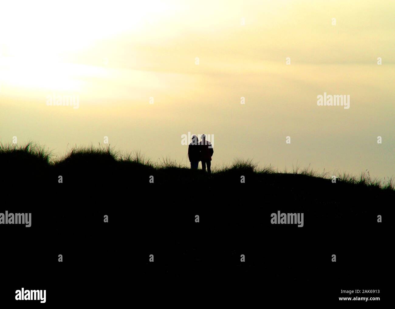 Couple in sunset Stock Photo