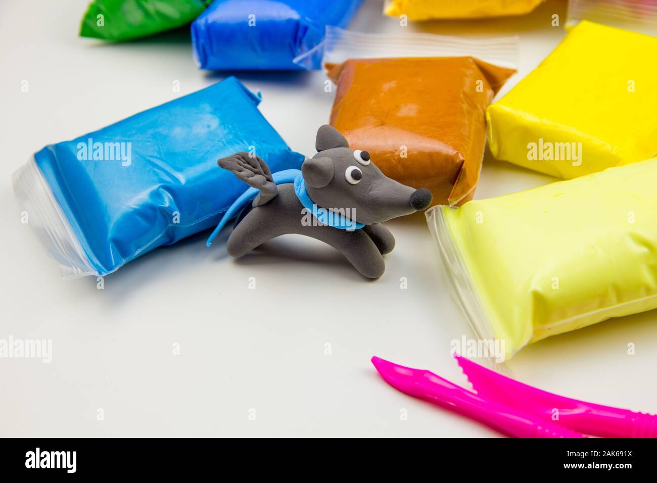 Set of Color Modeling Clay or Light Plasticine for modeling on the white  background Stock Photo - Alamy
