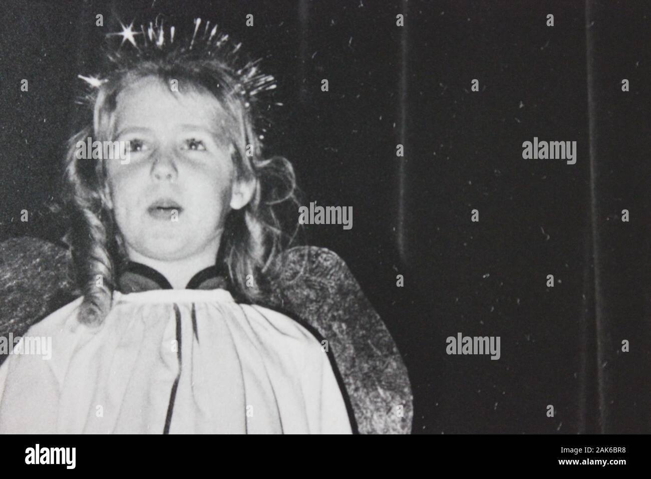 Fine Vintage Seventies Black And White Photography Of An Angel Girl Staging A Christmas Play