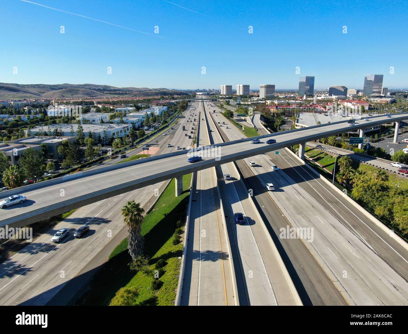 Aerial view of highway transportation with small traffic, highway interchange and junction, San 