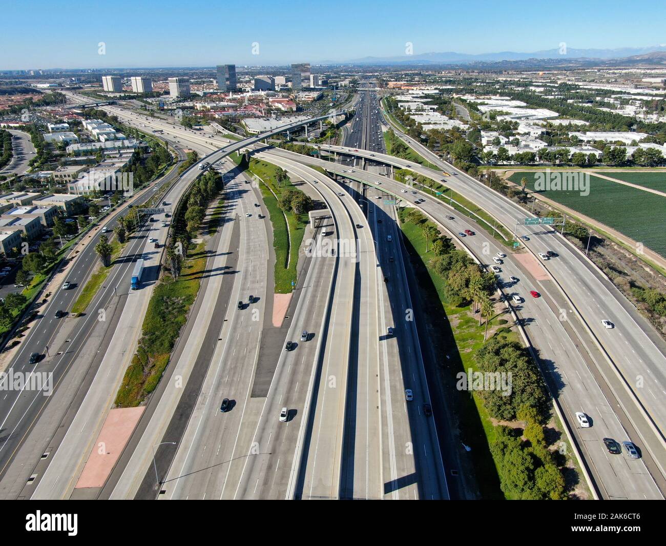 Aerial view of highway transportation with small traffic, highway interchange and junction, San 