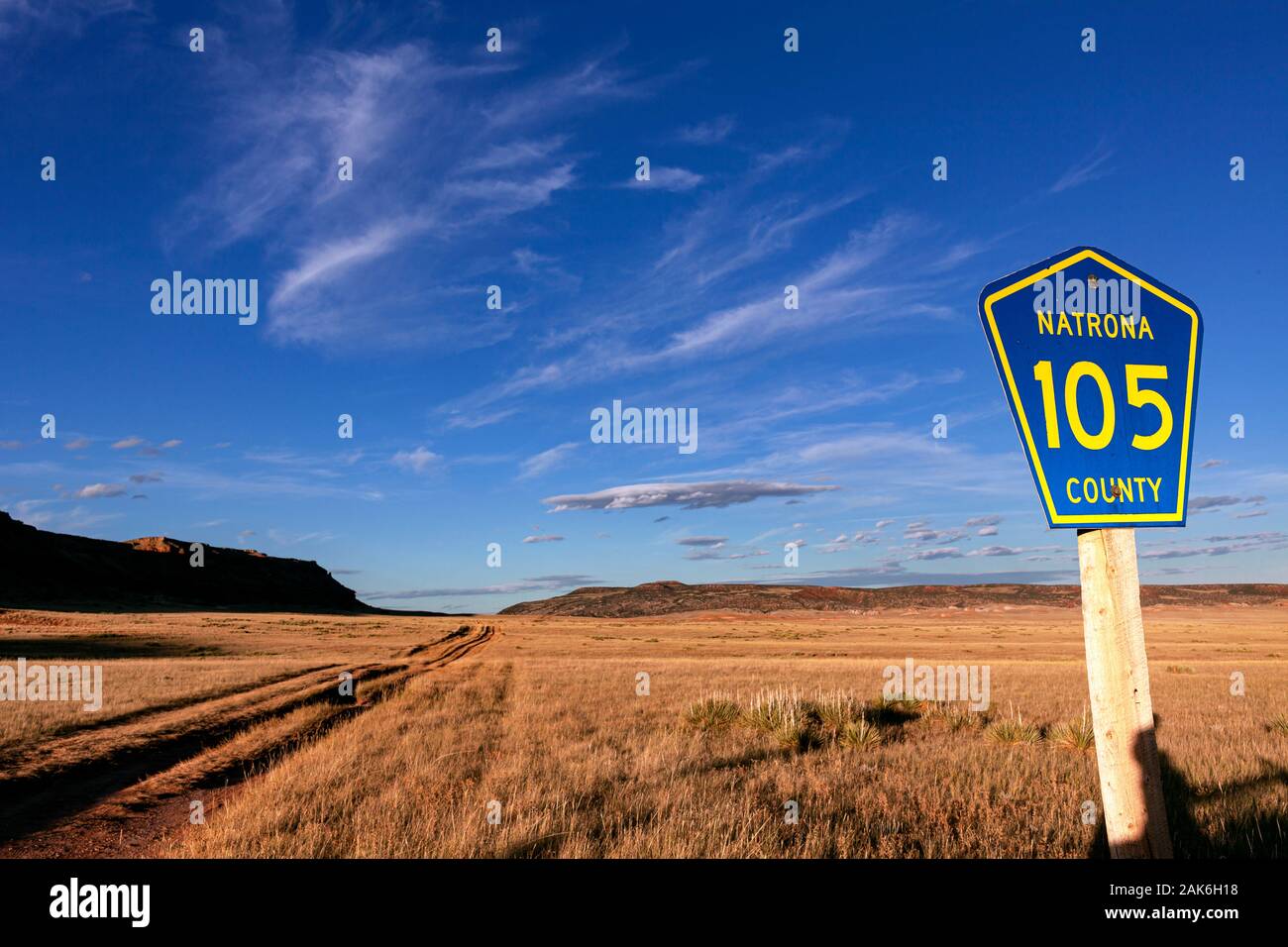 WY04129-00...WYOMING - Natrona County Road 105 is a rutted dirt road that cust across open grass lands. Stock Photo