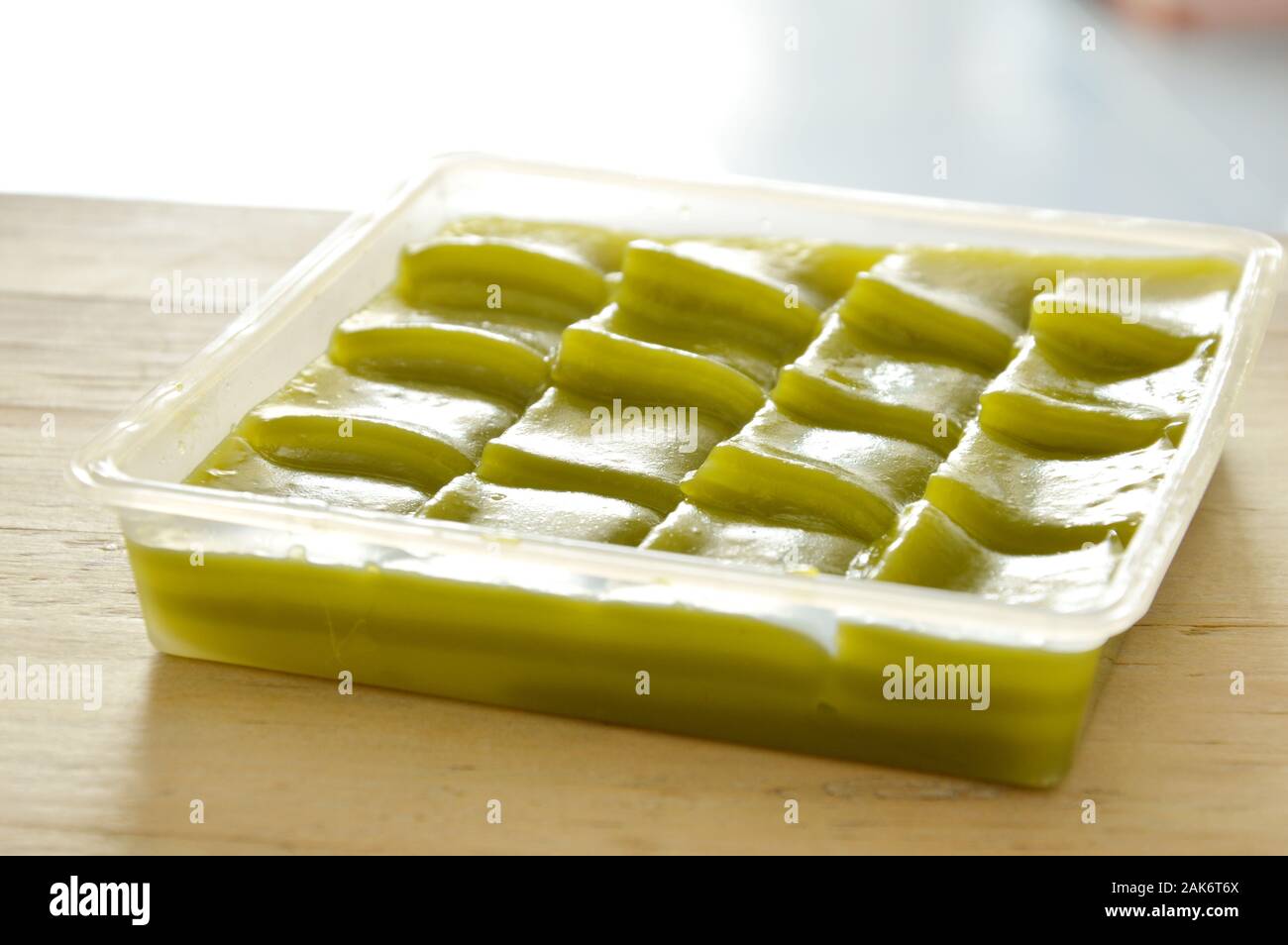 green layer sweet sticky cake Thai dessert on plastic tray Stock Photo