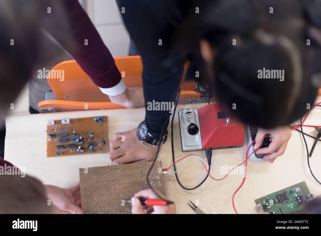 Group of young engineers working on robotics project. Scientist ...