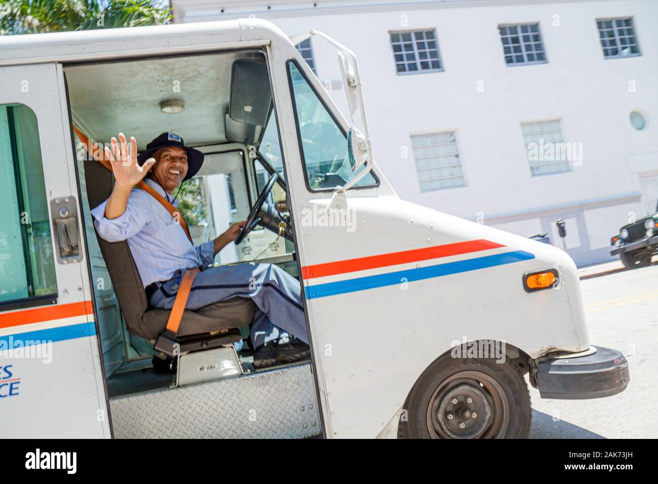 Miami Beach Florida,mailman mail postal truck van,Hispanic man driver driving, Stock Photo