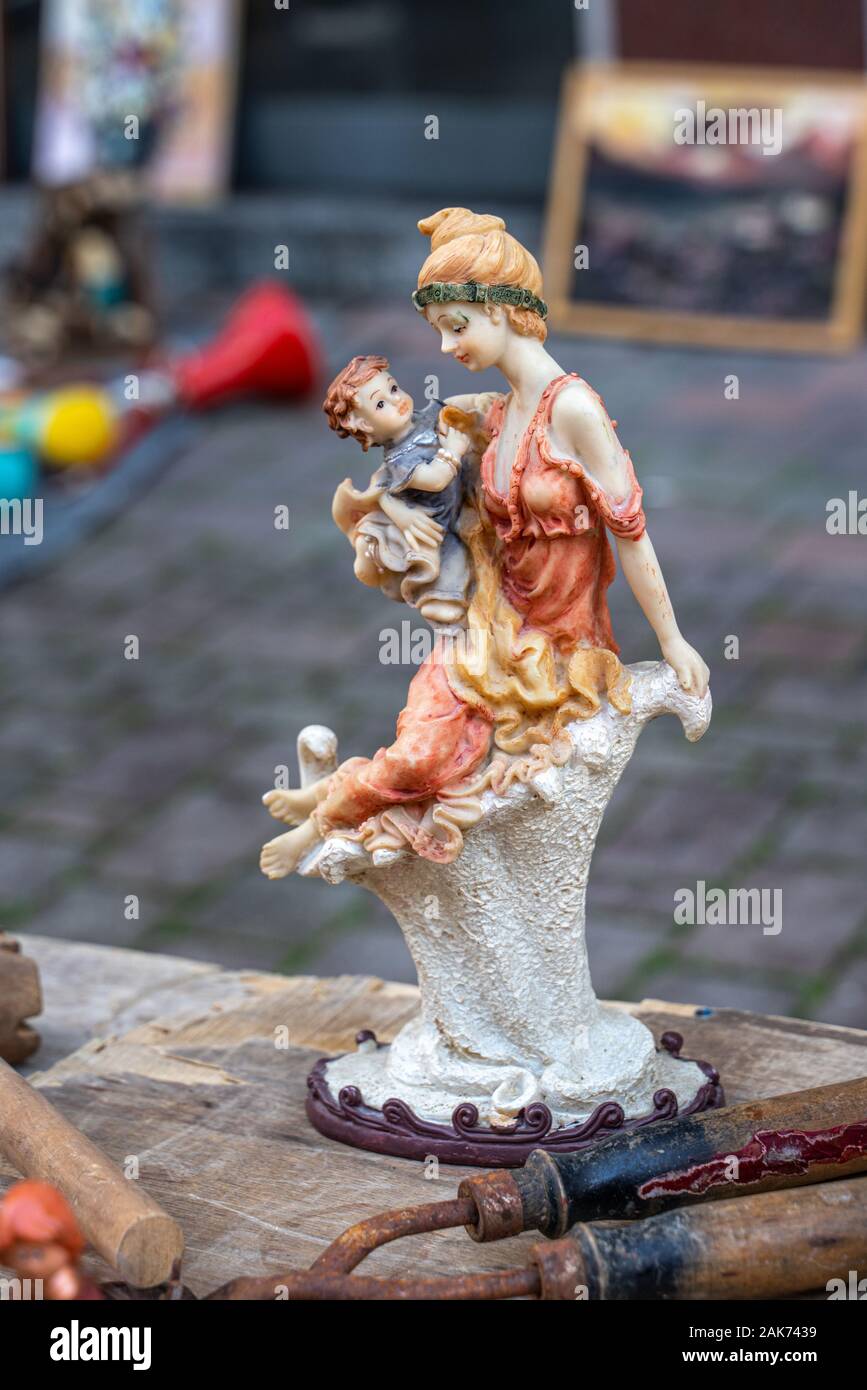 porcelain woman with son figurine at the flea market Stock Photo