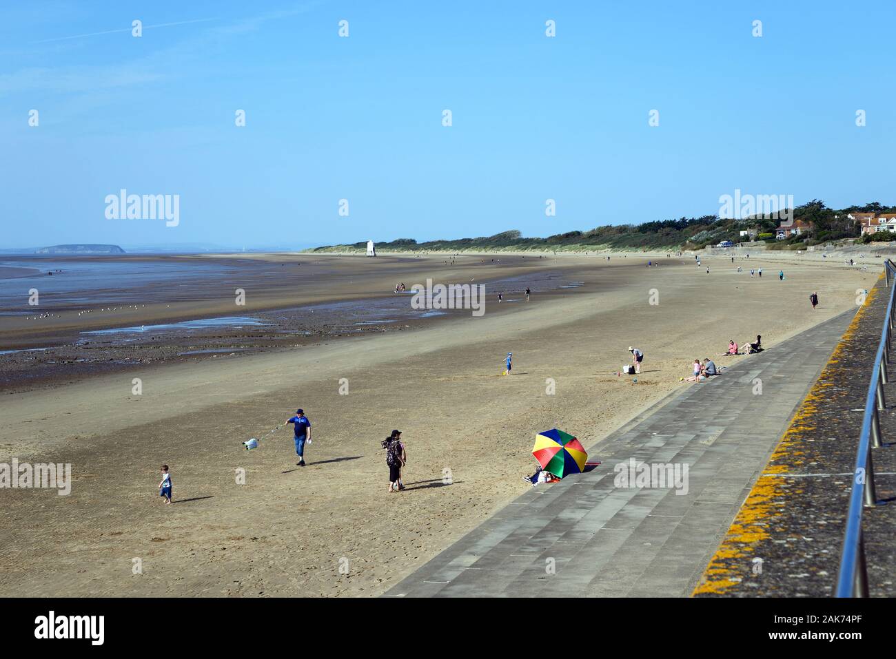 Tourists relaxing on the beach views along the coastline, Burnham-on-Sea, England, UK. Stock Photo