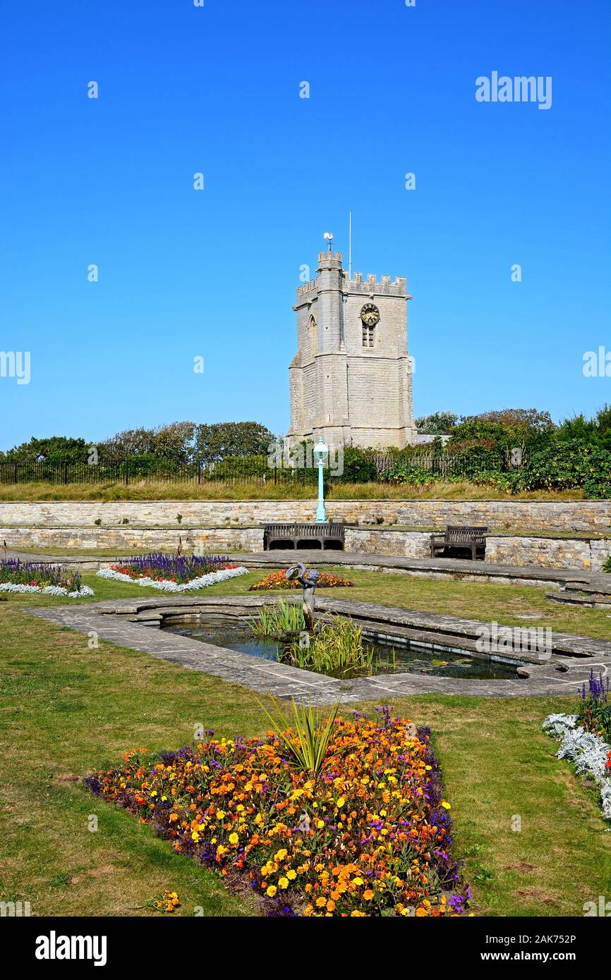 Fountain in the Marine Cove Gardens with St Andrews church to the rear, Burnham-on-Sea, England, UK. Stock Photo