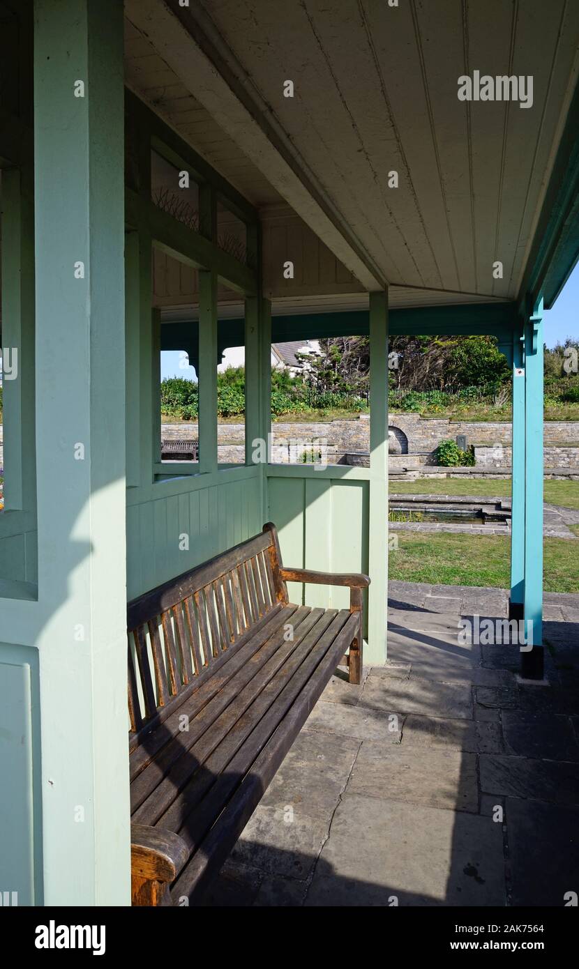 A wooden sheltered bench in the Marine Cove Gardens, Burnham-on-Sea, England, UK Stock Photo