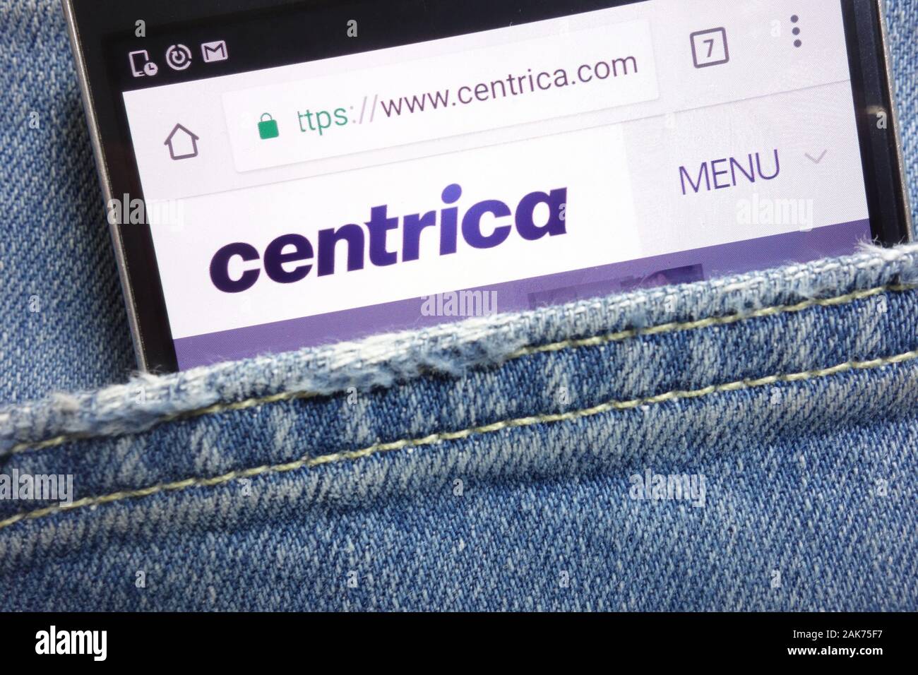 Centrica website displayed on smartphone hidden in jeans pocket Stock Photo