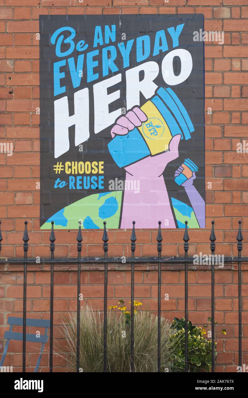 be an everyday hero, choose to re use, painted onto a red brick wall Stock Photo