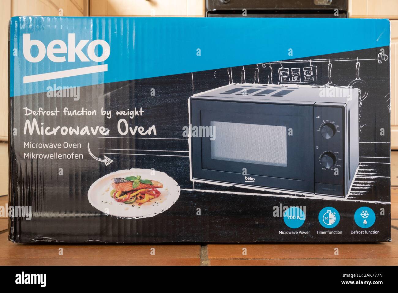 New Beko microwave oven in cardboard box packaging Stock Photo