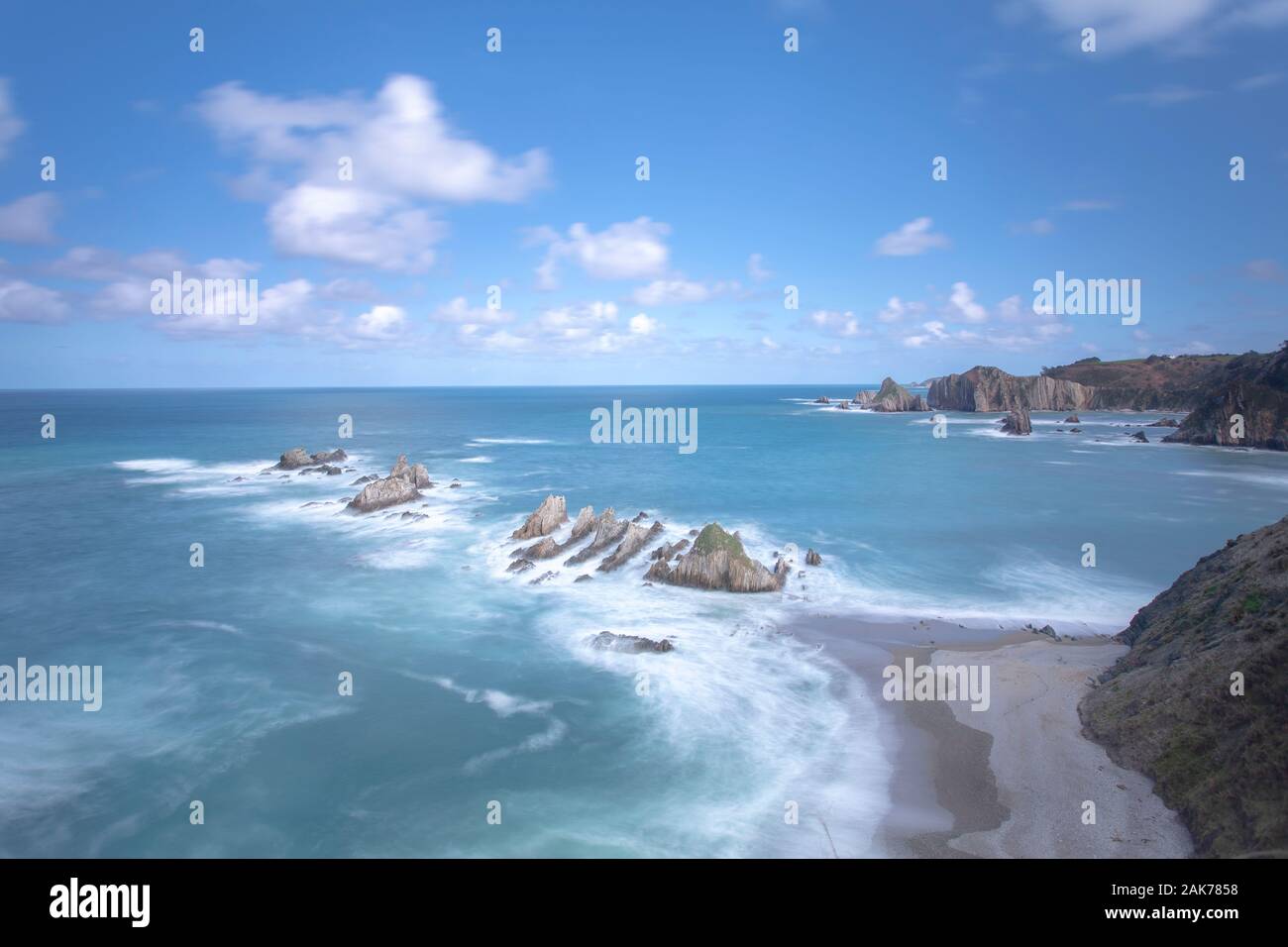 Long exposure landscape photography of a beach on the coast of Asturias, province of northern Spain Stock Photo