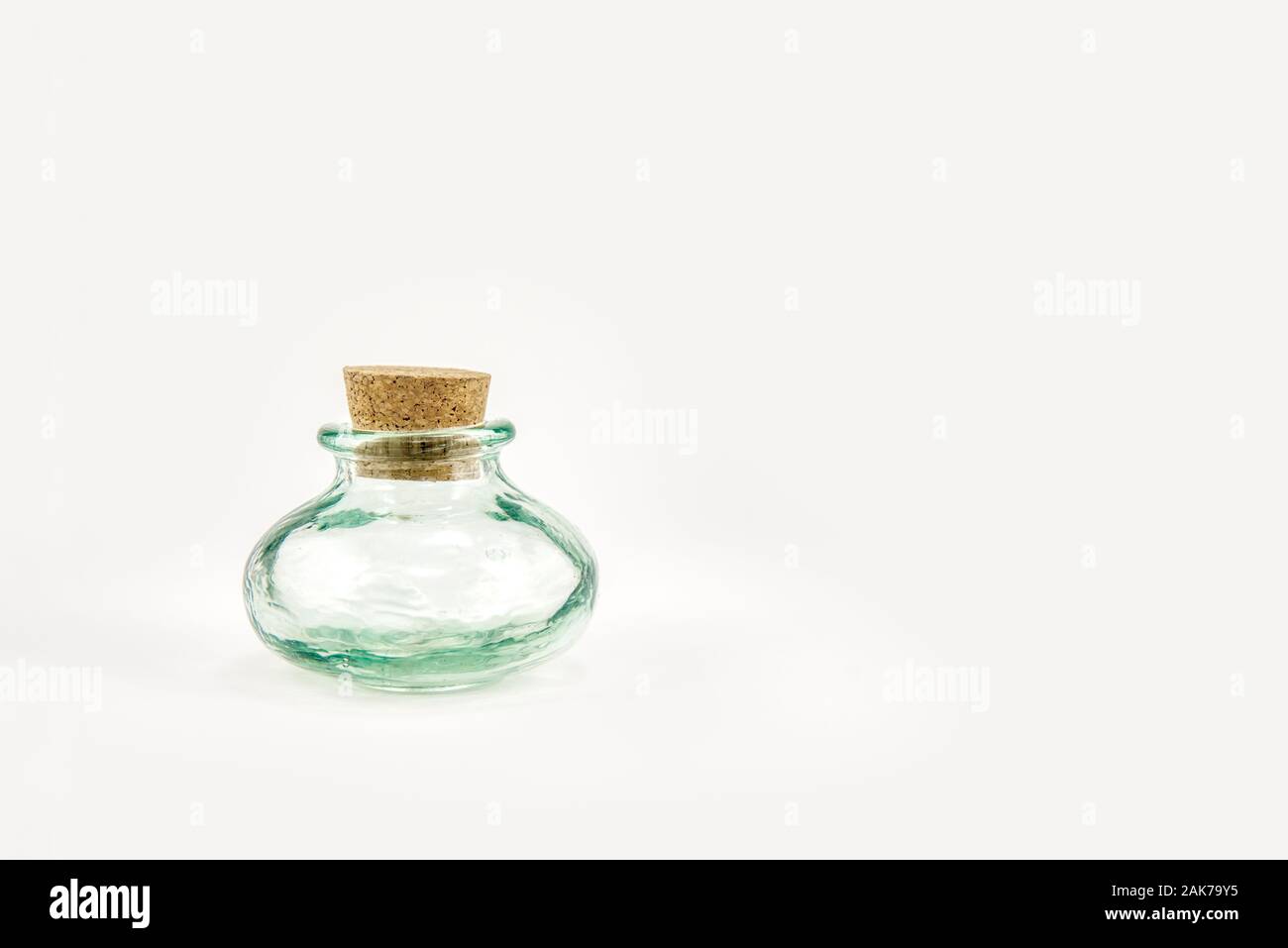 Small green glass bottle with cork stopper Stock Photo Alamy