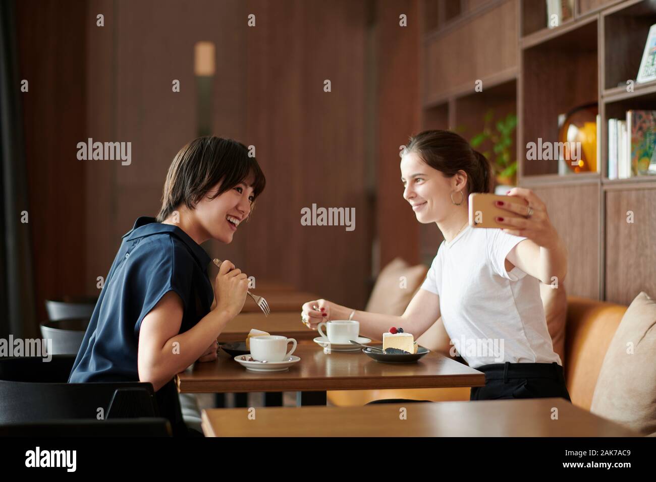 Young girlfriends at a cafe Stock Photo