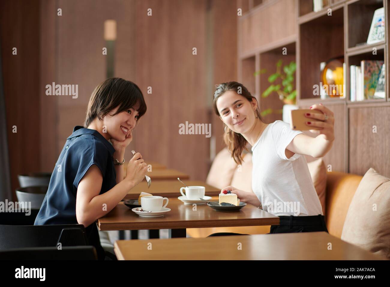 Young girlfriends at a cafe Stock Photo