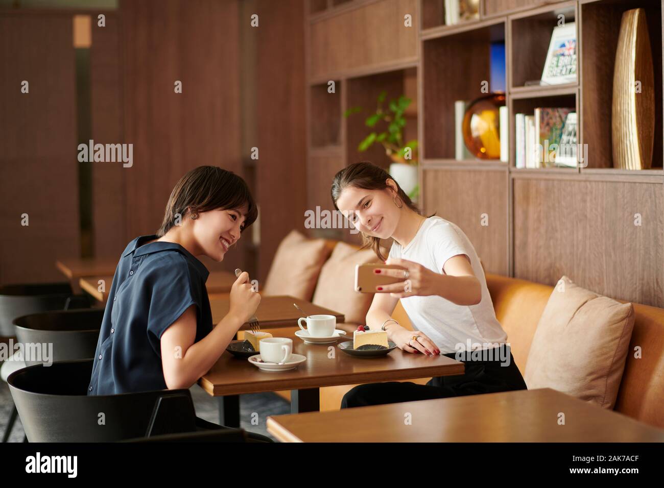 Young girlfriends at a cafe Stock Photo