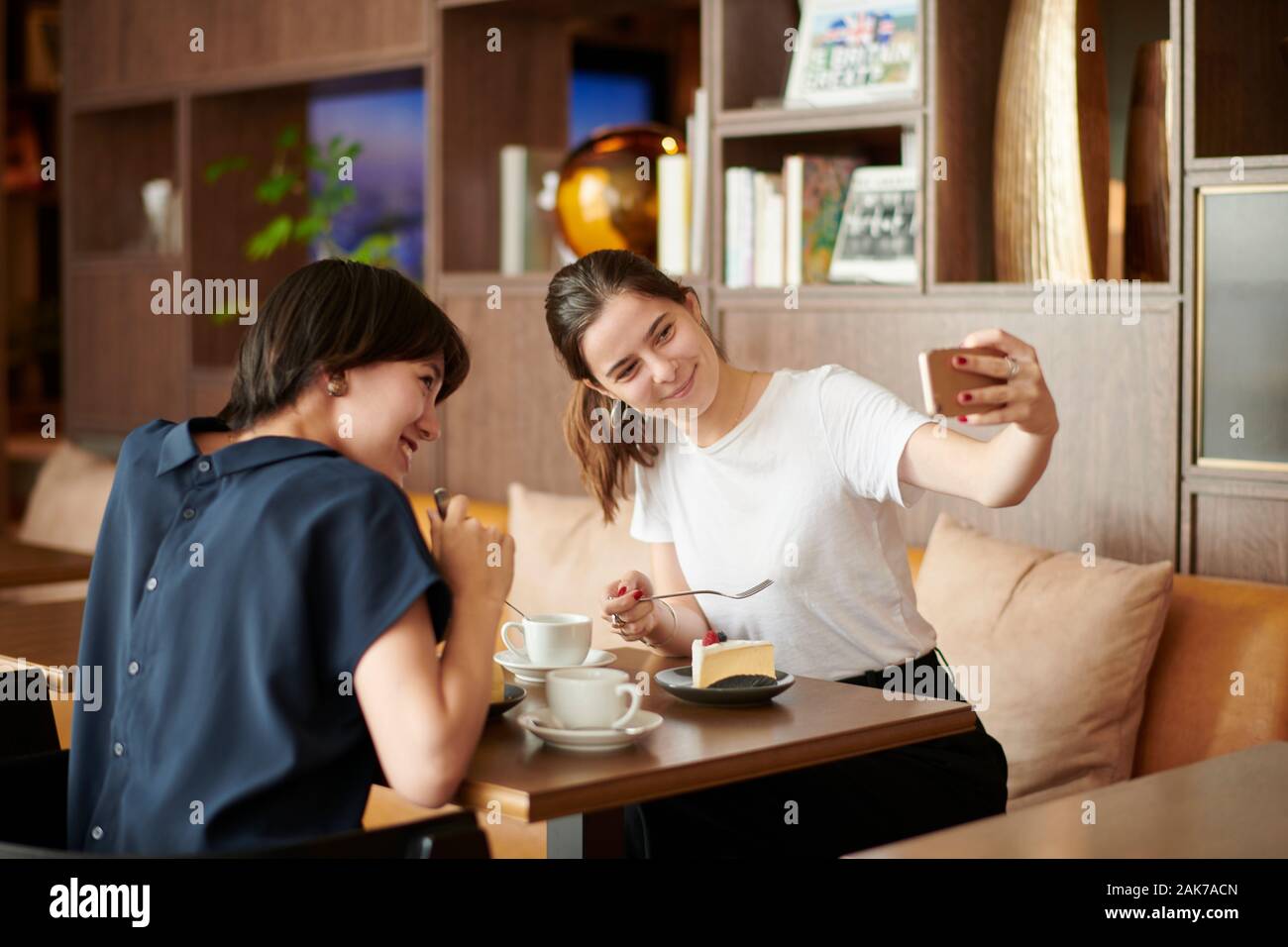 Young girlfriends at a cafe Stock Photo