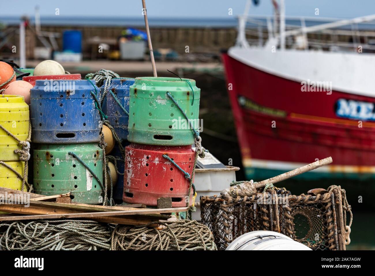 Lobster Pots and Buoys at Gourdon Harbour in Aberdeenshire, Scotland. Stock Photo