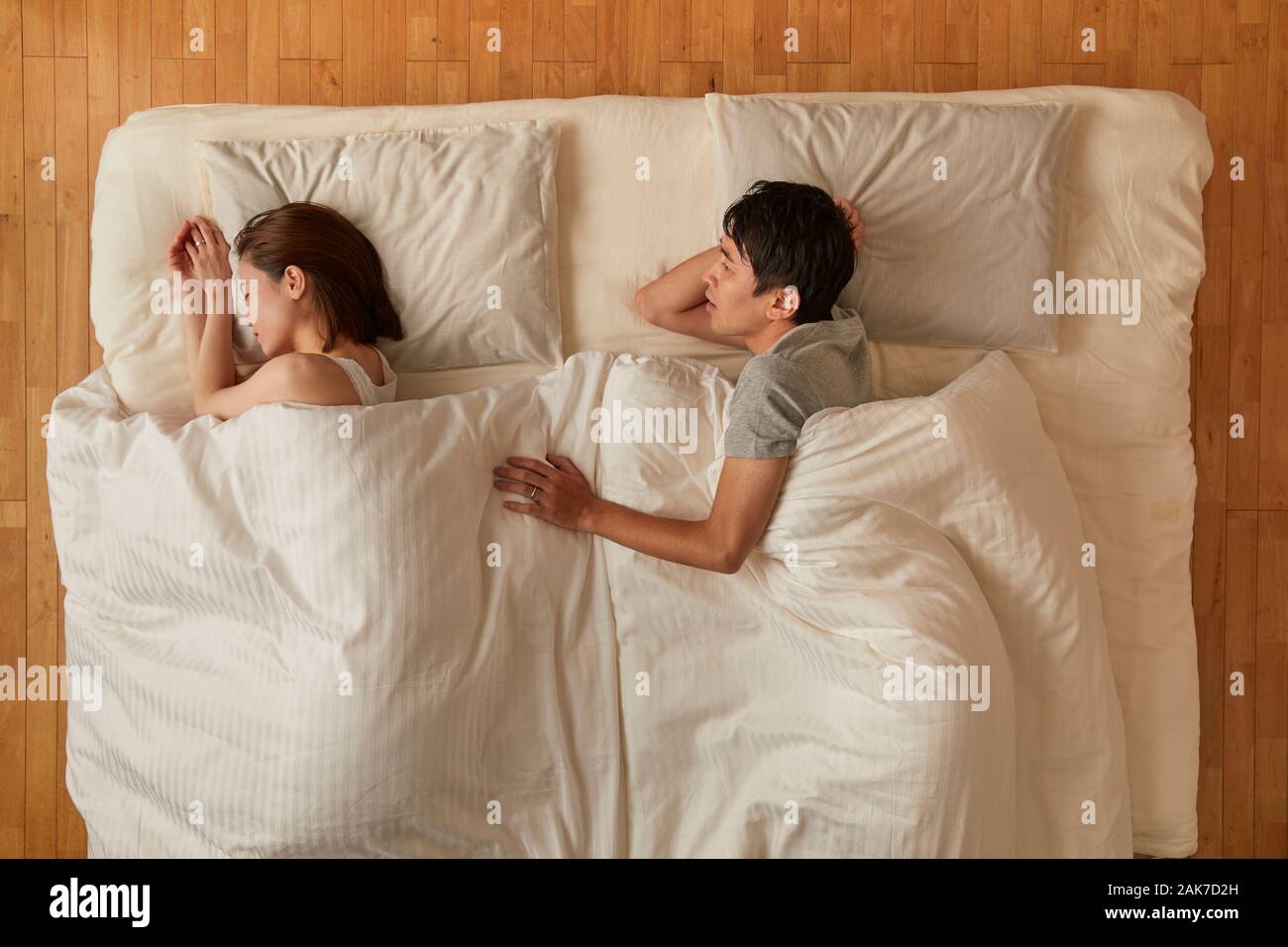 Japanese couple in bed Stock Photo