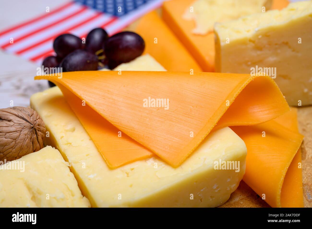Cheese collection, blocks and slices of yellow and matured american
