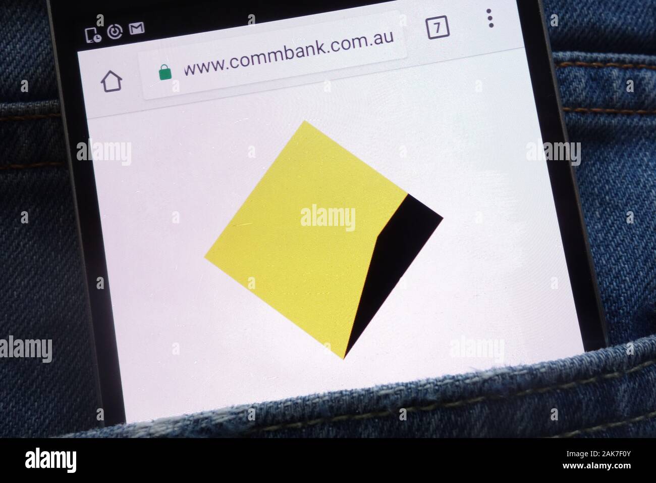 Commonwealth Bank of Australia website displayed on smartphone hidden in jeans pocket Stock Photo