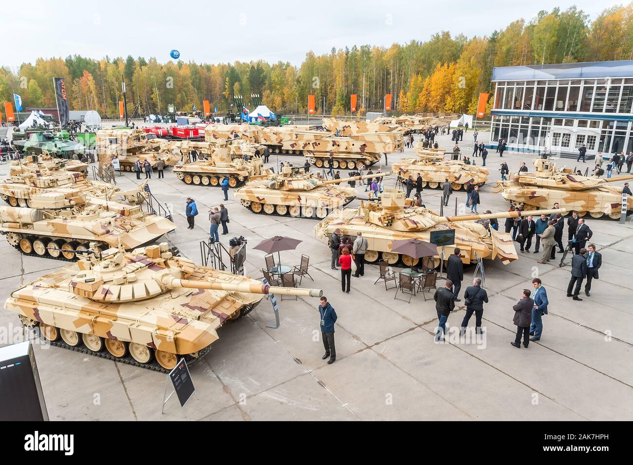 Visitors explore military vehicles on exhibition Stock Photo